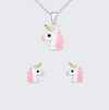 Unicorn-shaped necklace and earrings on a light gray background
