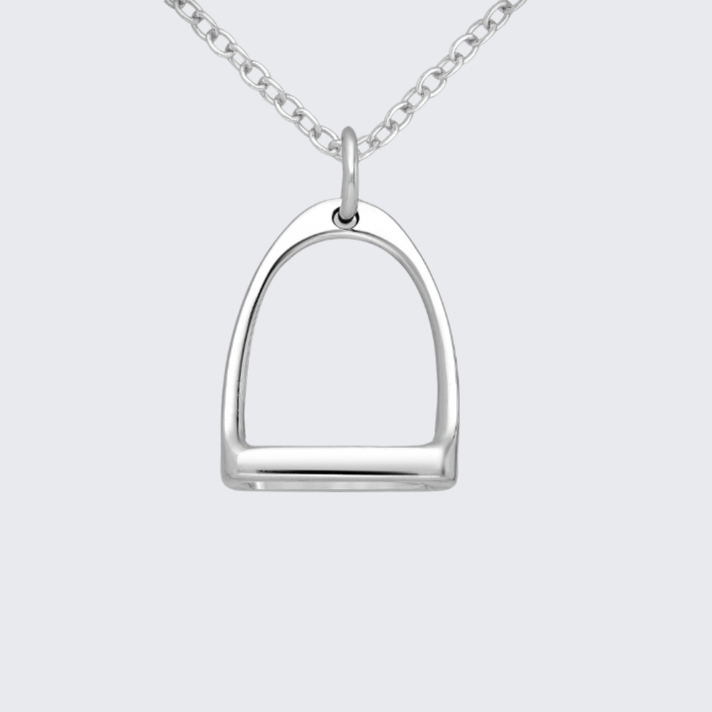 Silver equestrian stirrup pendant on a chain against a light gray background