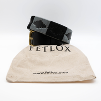 Black belt with a checkered pattern on a beige bag labeled 'Fetlox' on a white background