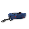 Blue dog leash with black clip on a white background