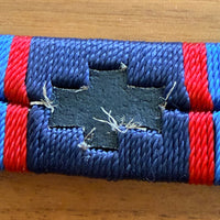 Blue strap with red accents on a wooden surface