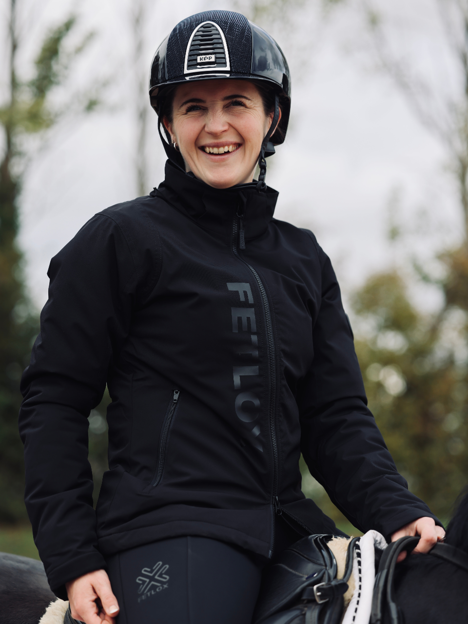 Girl wearing stride performance coat on a horse - fetlox 